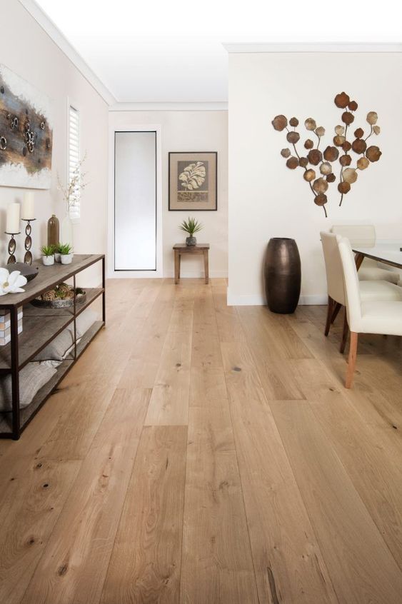 finish a neutral space with a neutral and warm-toned hardwood floor to make it more welcoming and cozy