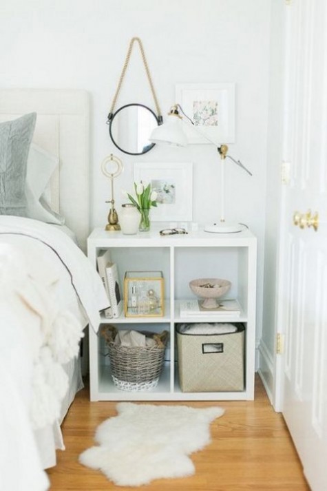 an IKEA Kallax shelf used as a stylish nightstand with much open storage that will fit most of bedrooms