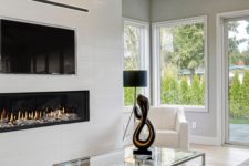 19 a white built-in minimalist fireplace under the TV is a stylish and elegant idea that adds coziness
