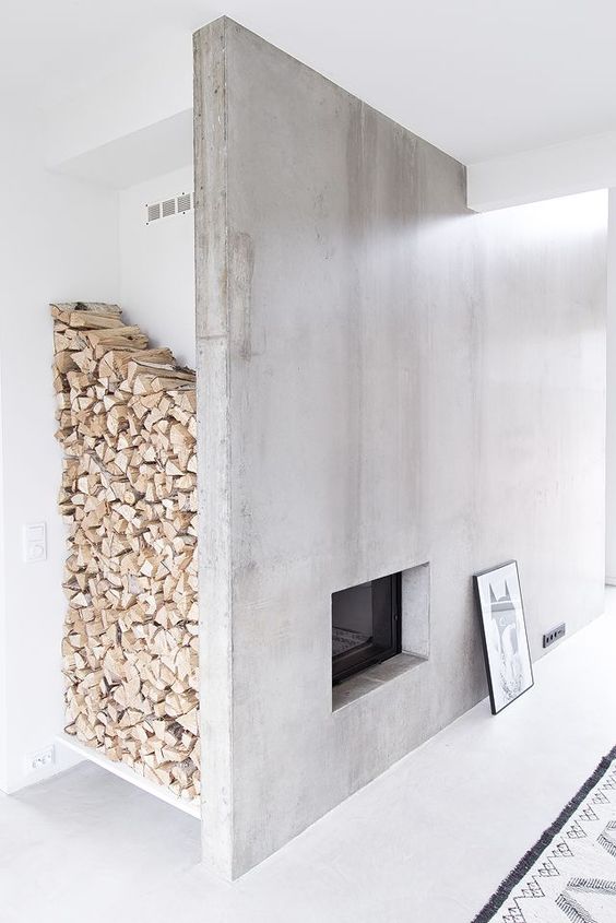 a concrete fireplace with a large firewood storage space by the corner is a very chic idea to go for