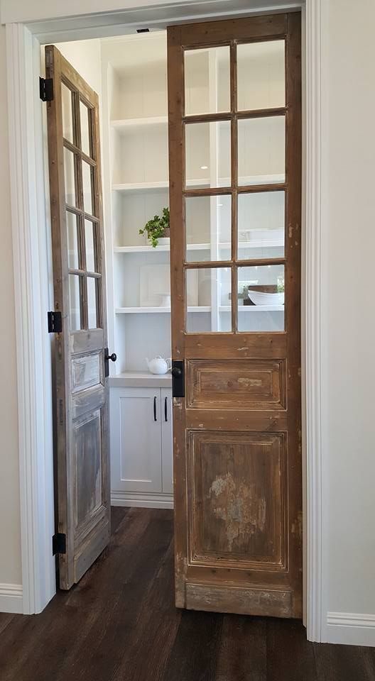 vintage French doors will let you see what's inside the pantry giving the space truly French chic