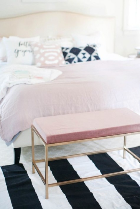an IKEA Fjallbo coffee table renovated into a chic and glam pink bench at the foot of the bed