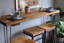 27 a tall industrial console table on hairpin legs and matching tall stools of wood and metal