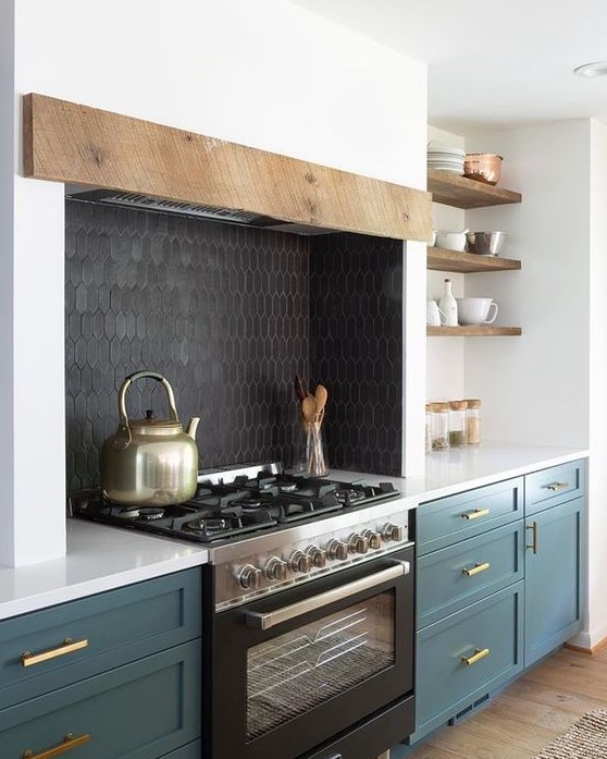 a black skinny tile backsplash and a black cooker add depth to the white and hunter green kitchen