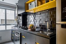 a modern black and yellow kitchen design