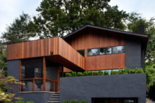 02 The exterior of the house is done in black and rich colored wood