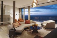 02 The living room features gorgeous views, there is chic geometric furniture and catchy pendant lights