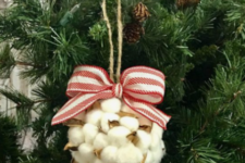 02 a cute and fluffy Christmas ornament of cotton and a striped red and white bow looks very fluffy and very cool