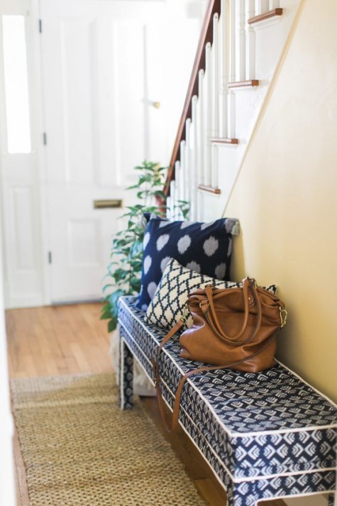 an IKEA Bjursta bench hack with printed navy and white fabric for a mudroom that lacks a sitting piece