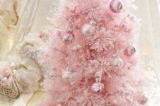 03 a pretty pink Christmas tree with shiny metallic ornaments that match in color and some pearly beads as decor