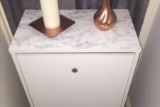 03 an IKEA Bissa hack done with copper knobs and marble contact paper is a small and stylish piece for any entryway