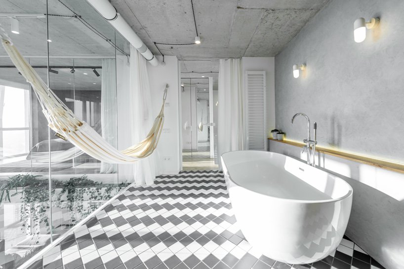 The bathroom is hidden behind glass doors and can be made private with curtains, there's a hammock for relaxation