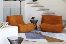04 There are some bright and bold accents, and these orange chairs are among them