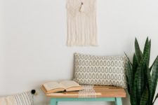 04 a DIY IKEA Skogsta bench hack with bright paint and rope will fit a boho entryway easily