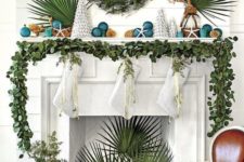 04 a greenery garland on the mantel, a greenery wreath and tropical leaves for beach Christmas styling