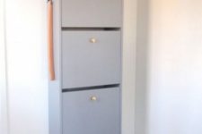 04 a light grey IKEA Bissa cabinet with elegant gilded knobs is a stylish contemporary idea for storing your shoes