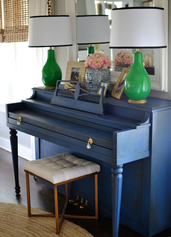 a vintage piano painted classic blue and accented with crystal knobs will add a vintage yet trendy touch