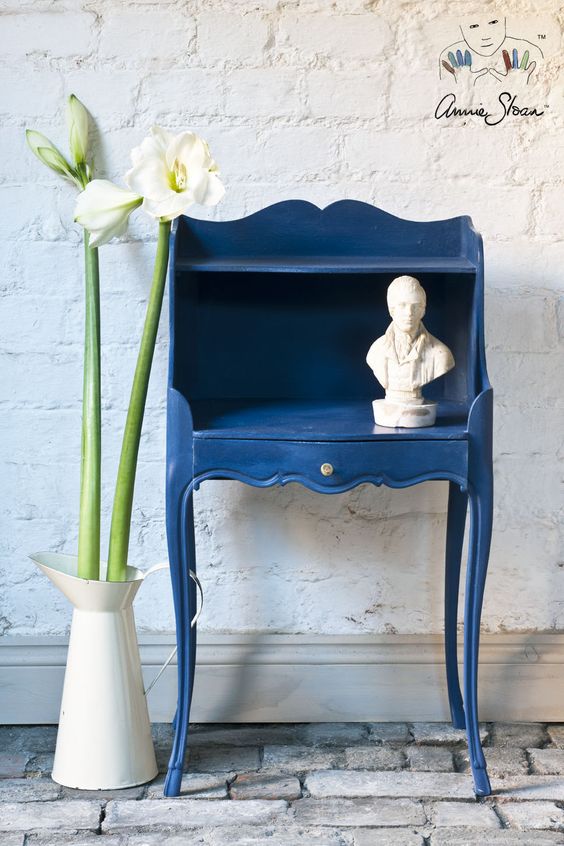 a vintage furniture piece painted classic blue is a chic and refined idea that will make your space trendy
