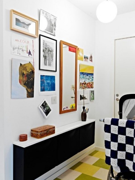 a black IKEA Trones with a white countertop for a small entryway and colorful decor around to create a contrast