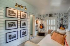 09 One more guest bedroom features a stylish gallery wall and a couple of guitars