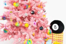 09 a bright pink Christmas tree with funny and colorful modern ornaments looks fresh and very bold