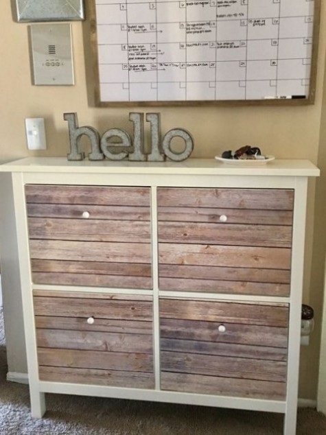 a cozy rustic IKEA Hemnes shoe storage piece done with weathered wooden planks, which can be substituted with some tape
