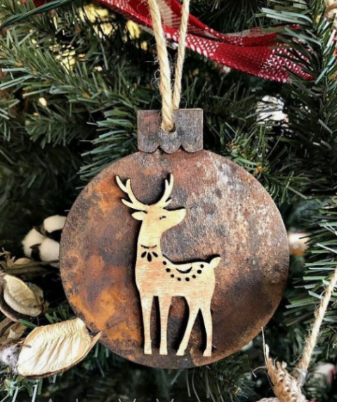 a wooden Christmas ornament with rust decor and a little wooden deer on it is super cute and nice