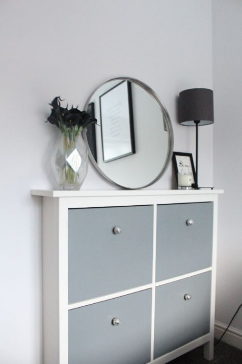 a grey IKEA Hemnes hack with mercury glass knobs for a contemporary entryway with lack of space
