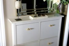 12 a white Hemnes shoe storage piece with new handles that bring a fresh look and a new feel