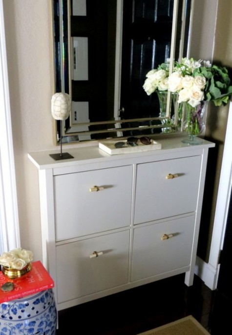 a white Hemnes shoe storage piece with new handles that bring a fresh look and a new feel