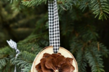 12 wood slice Christmas ornaments with pinecone flowers and plaid ribbons are very cute and all-natural