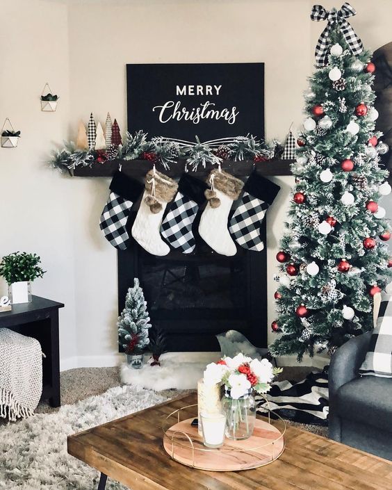 buffalo check and white stockings with faux fur, buffalo check bows and fake trees for Christmas
