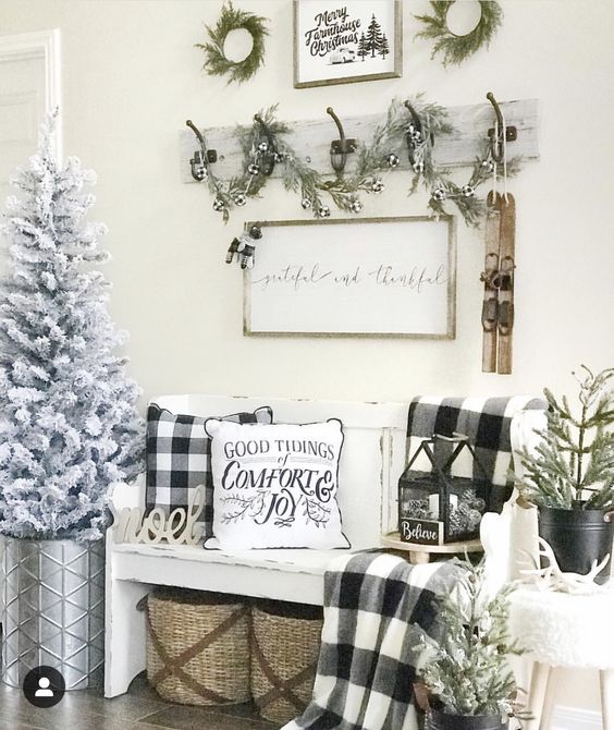 buffalo check pillows and a blanket for adding a cozy vintage Christmas feel to your entryway