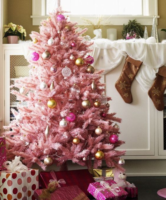 a pastel pink Christmas tree with sheer, gold and pink ornaments with a vintage feel looks very sophisticated