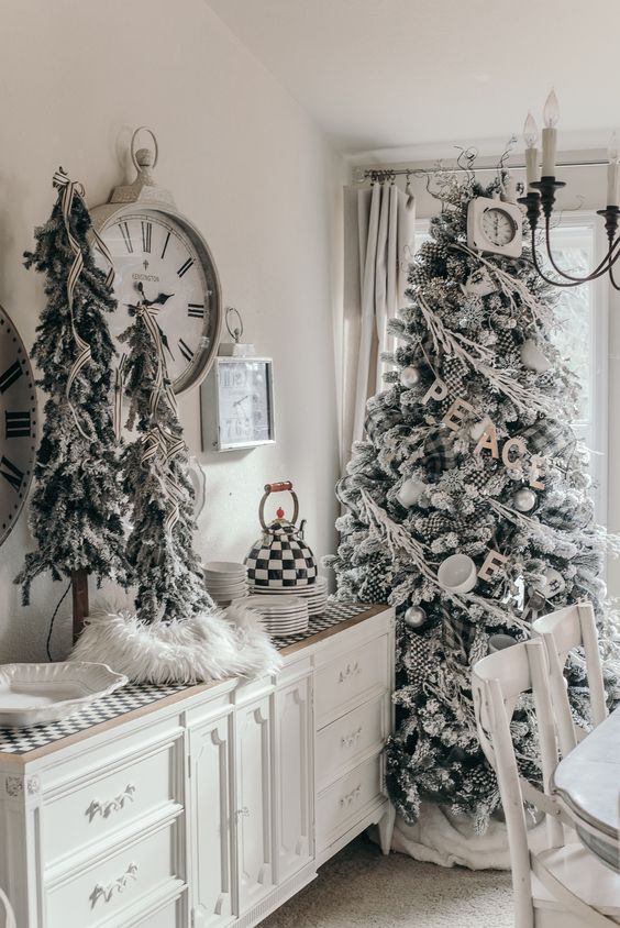 snowy Christmas trees decorated with striped ribbons, plaid ornaments, cups and silver ornaments