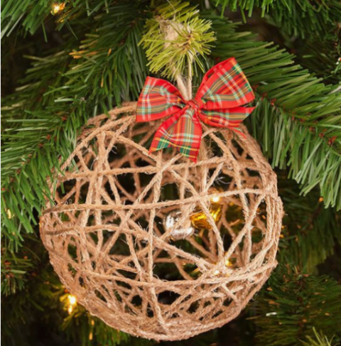a yarn Christmas ball ornament with bells inside and a red plaid bow on top is a pretty and whimsy idea