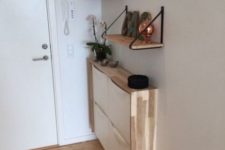 20 a sleek entryway console of an IKEA Trones item with a plywood waterfall countertop for a contemporary look