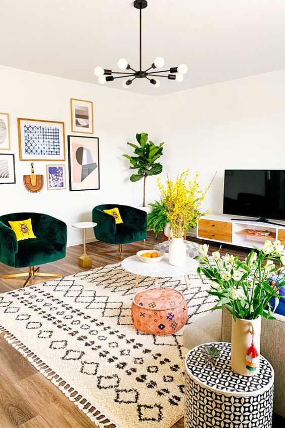 a neutral living room spruced up with bright and colorful furniture, accessories and artworks