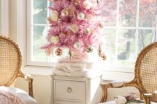 22 a pink Christmas tree with gold ornaments, gold beads and roses plus a bow on top looks refined and vintage-like