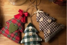 22 mini Christmas tree ornaments in plaid fabric, with felt hearts, berries, pinecones and twine on top