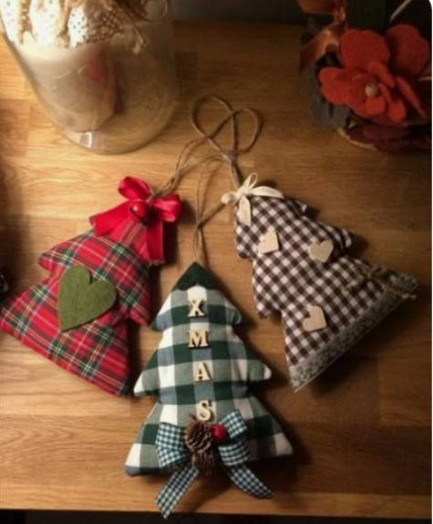 mini Christmas tree ornaments in plaid fabric, with felt hearts, berries, pinecones and twine on top