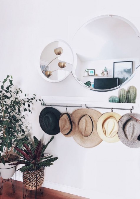 an IKEA Mosslanda shelf or sleek console with hat holders is an ultimate piece for a contemporary or boho entryway