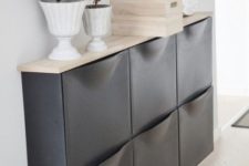 24 a chic IKEA Trones storage cabinet painted black and given a new top that contrasts it a lot