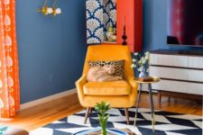 24 a super bright and fun living room with blue walls, colorful furniture and accessories plus textiles