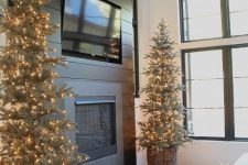 Christmas tree with lights placed in baskets are great for rustic and farmhouse living room decor during the holidays