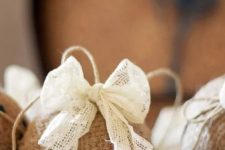 a burlap ornament with a lace bow is a cute vintage-inspired and rustic decoration