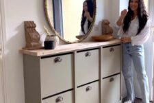a lovely entryway console table with shoe storage