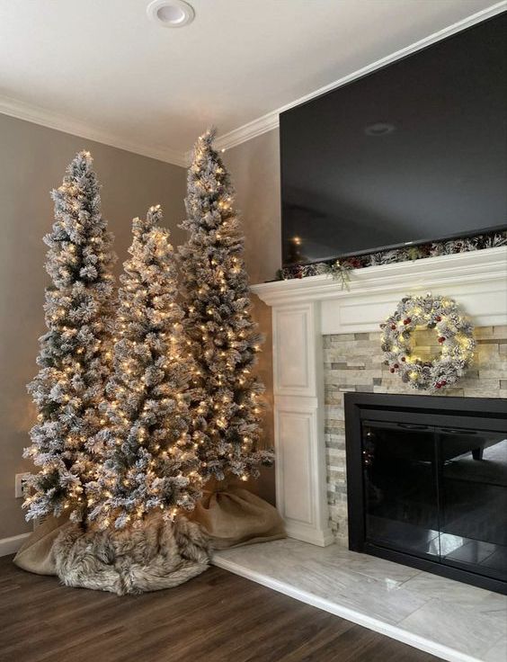 A farmhouse Christmas tree cluter with only lights looks very natural and very eye catching