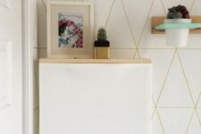 a simple IKEA Trones hack with a light-colored wooden tabletop makes up a floating console table