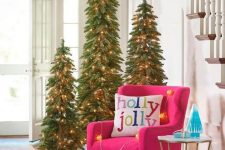 a trio of Christmas trees with lights will make your entryway special